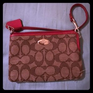 Coach wristlet tan with red trim